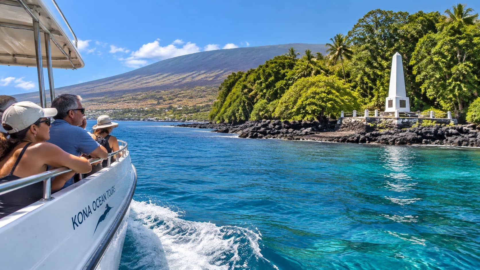 Tourists on a boat arriving at the Captain Cook Monument in Kealakekua Bay on the Big Island.