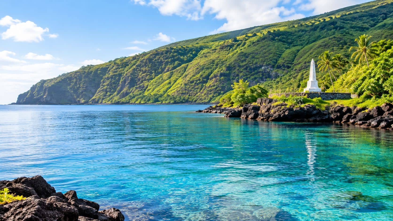 A picturesque coastal view of the Captain Cook Monument in Kealakekua Bay on the Big Island of Hawaii.
