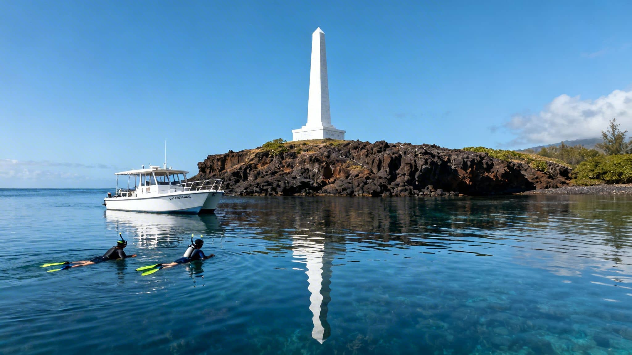 Two snorkelers enjoy clear blue waters near a boat and a white monument on a rocky island.